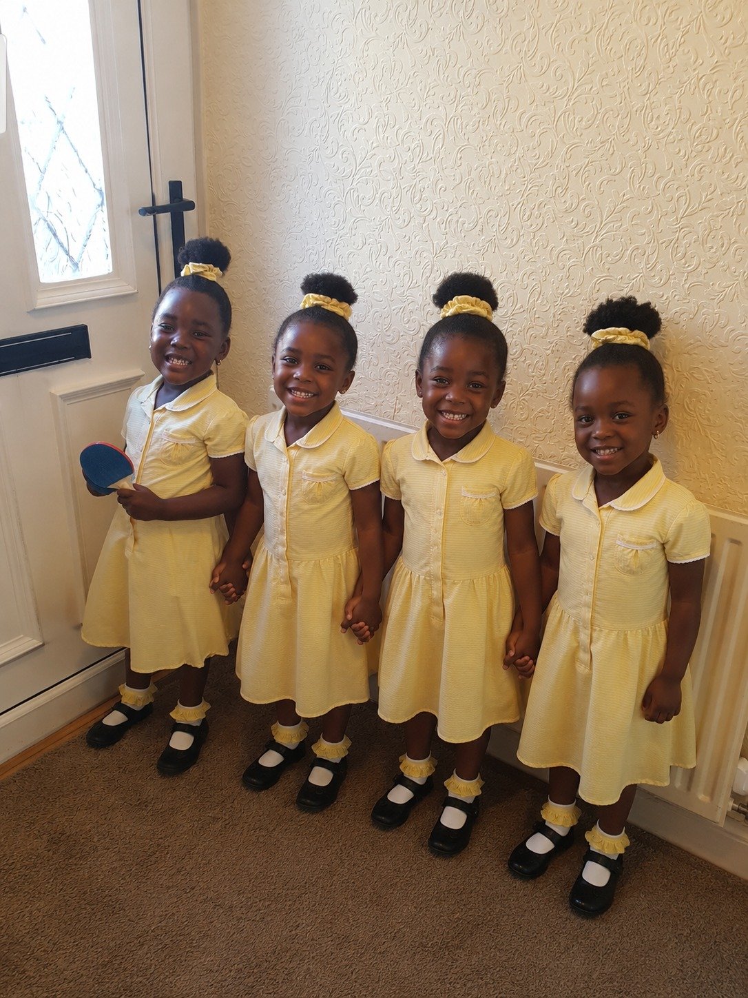 EBLIS pupils in their uniform, smiling together